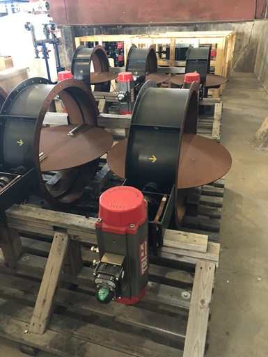 Photo of industrial equipment components in various states of assembly