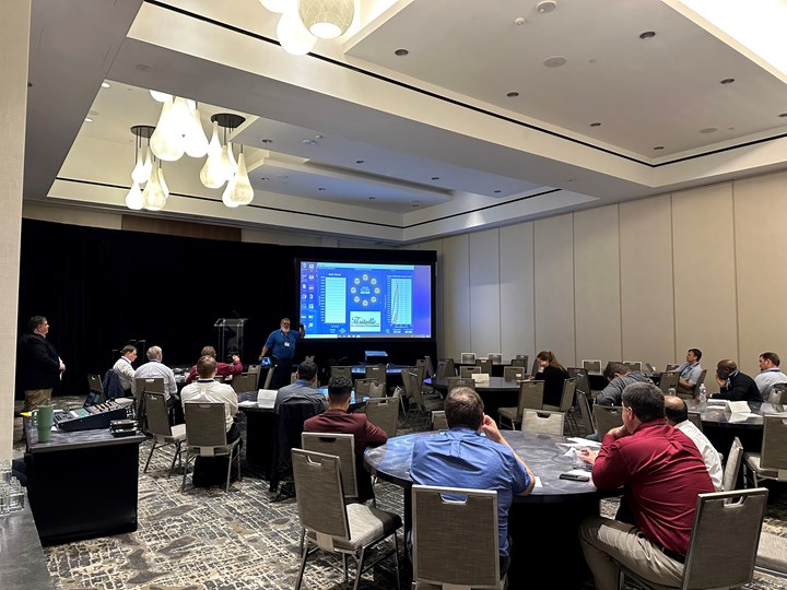 Photo of Russ Currie of Flexitalic teaching a room full of people how to assemble gaskets for valves.