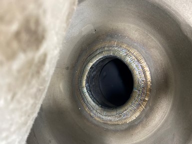 Photo of repaired bonnet valve backseat with new welds, heat treatment and restelliting.